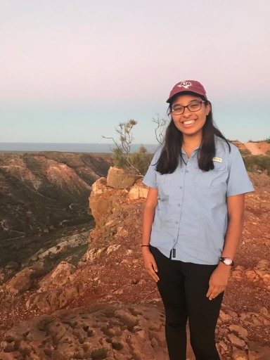 Hispanic ecologist standing over Western Australia canyon